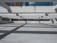 a skateboard is balanced against the building's steel beams in this photo from a low angle