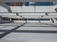 a skateboard is balanced against the building's steel beams in this photo from a low angle