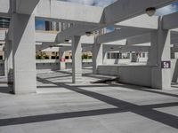 a large concrete parking lot with multiple levels on it that are empty except the ground