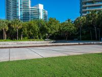 this is a small plaza in front of a tall building on a sunny day,