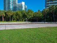 this is a small plaza in front of a tall building on a sunny day,