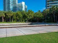 this is a small plaza in front of a tall building on a sunny day,