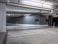 an empty parking garage with no people around it and several storage spaces on the wall