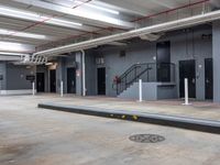 a man riding a skateboard up the side of a ramp in an industrial building