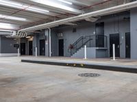 a man riding a skateboard up the side of a ramp in an industrial building