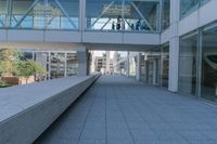 the empty concrete benches in the courtyard of an office building are empty, and no one was allowed in