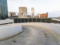 a man riding a skateboard down the side of a ramp on a city street