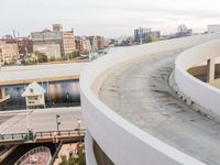 a man riding a skateboard down the side of a ramp on a city street