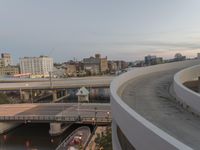 a man riding a skateboard down the side of a ramp on a city street