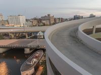 a man riding a skateboard down the side of a ramp on a city street