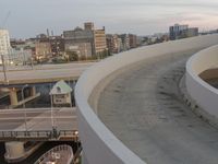 a man riding a skateboard down the side of a ramp on a city street