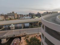 a man riding a skateboard down the side of a ramp on a city street