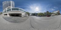 a view into a fisheye lens looking down an empty street and into the parking lot