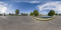 a 360 - camera photo of a wide angle view of a road with buildings around it