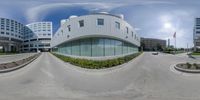 a large building is in a very circular panoramic lens shot of a building