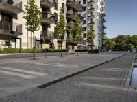 modern apartment buildings are shown against a clear blue sky and sunny day outside the city