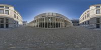 fish eye lens view of a building with large glass windows in the center of this view