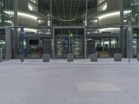 an office building with a metal door leading out to a large space for people to walk through