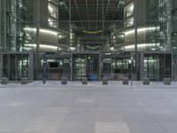 an office building with a metal door leading out to a large space for people to walk through