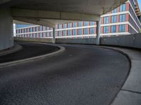 a car is driving on the highway through an underground parking garage area in a city