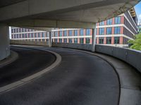 a car is driving on the highway through an underground parking garage area in a city