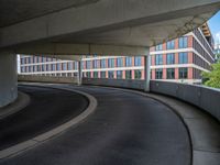 a car is driving on the highway through an underground parking garage area in a city