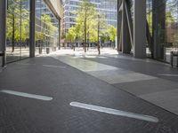 empty walkway in an outdoor area, with people walking along the side walk and on the sidewalk