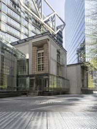 large building with a metal and glass structure on one side and large windows on the other