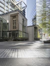 large building with a metal and glass structure on one side and large windows on the other