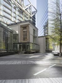 large building with a metal and glass structure on one side and large windows on the other