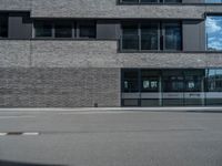 a car is parked in front of the building that sits next to it on the street