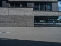 a car is parked in front of the building that sits next to it on the street