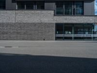 a car is parked in front of the building that sits next to it on the street