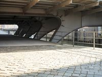 view from underneath of a building along with a bike parked on it's side