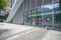 some very nice buildings that have banners in front of them at the doors of the building