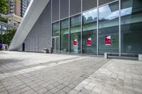 some very nice buildings that have banners in front of them at the doors of the building