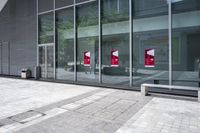 some very nice buildings that have banners in front of them at the doors of the building