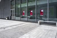 some very nice buildings that have banners in front of them at the doors of the building