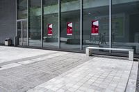 some very nice buildings that have banners in front of them at the doors of the building