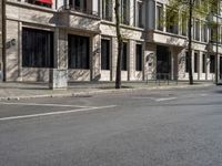 a building with windows and signs on the side of it on a city street in europe