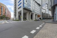 a long building is shown with a street view of the building and sidewalk, all in one corner