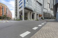 a long building is shown with a street view of the building and sidewalk, all in one corner