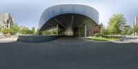 360 - view of the building entrance in the city with the sky in the background