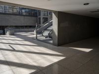 a lobby area inside the building with stairs and steps in the background on a clear day