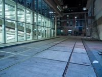 large windows inside a very modern building at night in the city of london, england