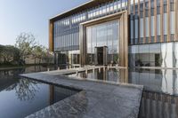 the entrance of a building is reflecting the water on the floor and walls, making smoke rising from the windows