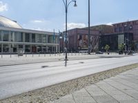 an empty city street that is in the daytime time with several signs on it's sides