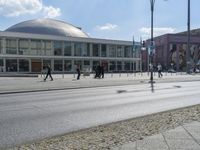 an empty city street that is in the daytime time with several signs on it's sides