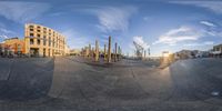 a 360 - view image of a city street and buildings with lots of columns and poles