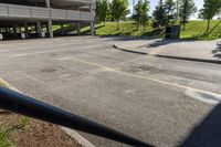 this street has a parking garage, and it's empty but a road will be perfect